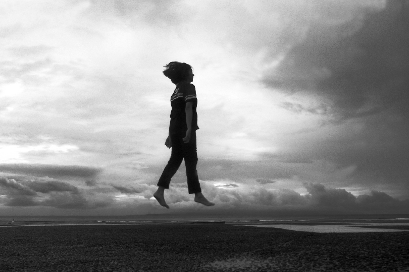 Image of a person confidently stepping out of a shadow (Subconscious Transformation and Permanent Change