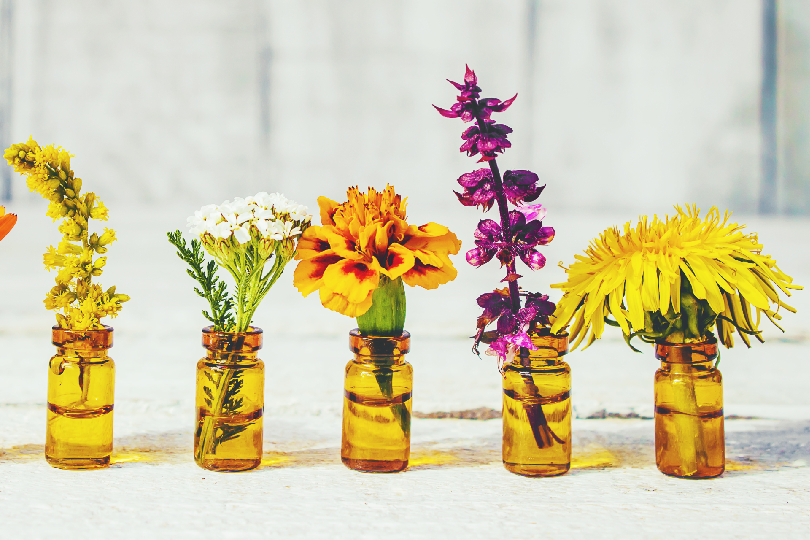 Image of different colored flower essences in bottles (Bach Flower Remedies in Andheri Mumbai for Emotional Healing)