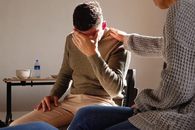 1. A person experiencing relief from a migraine through hypnotherapy for pain management.